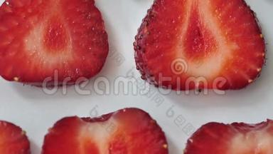 草莓背景运动设计视频.. 生物切片水果浆果。 颜色纹理接近。 4k3840x2160
